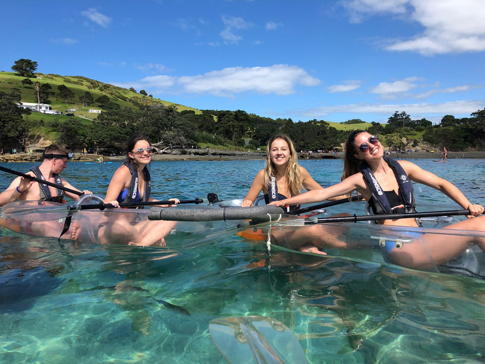 a group of people in a clear kayak at goat island